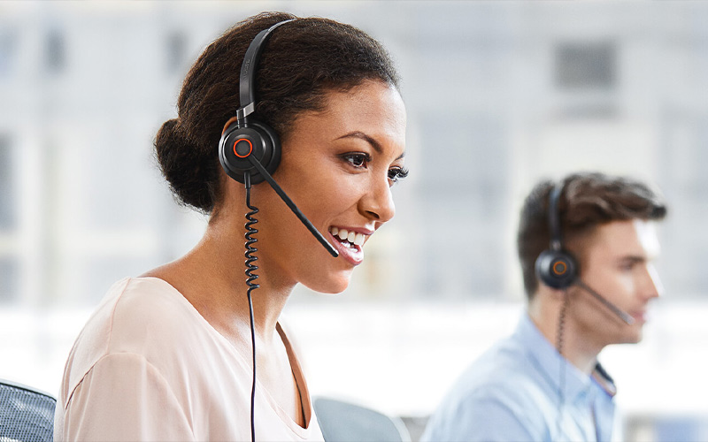 Smiling man wearing Evolve headset