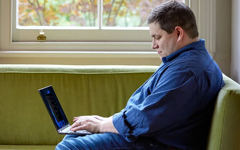 Microsoft man using laptop