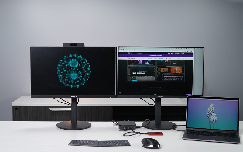 Two monitors and a laptop connected to a targus docking station