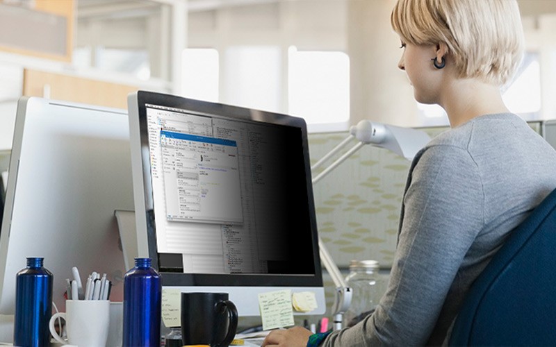 woman working with a black privacy filter