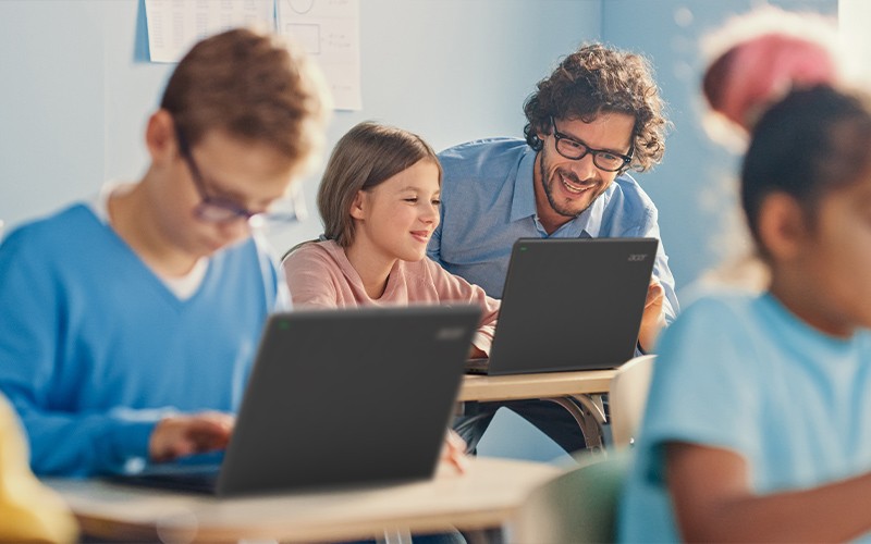 School admins can quickly and securely prepare their school’s Chromebooks to go home with students Girl and teacher using laptop