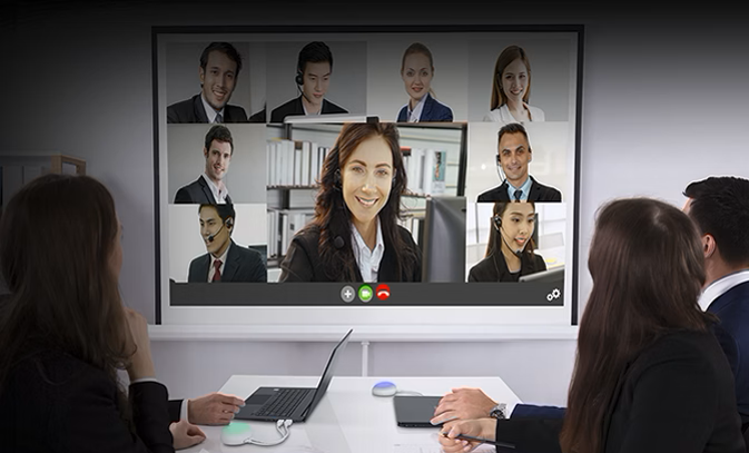 People in a meeting watching the Acer Projector