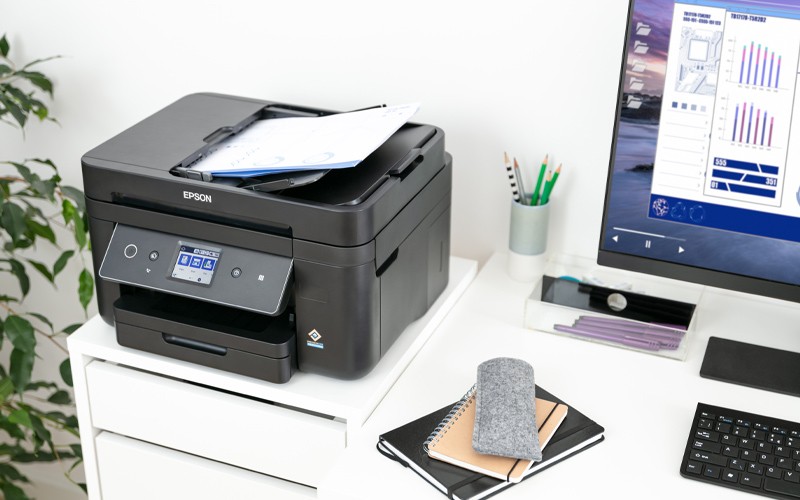 Woman working at Epson printer in open office