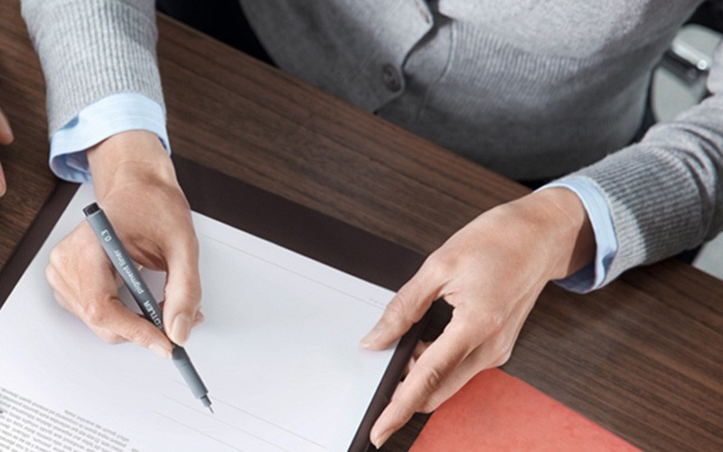 Someone signing a digital document