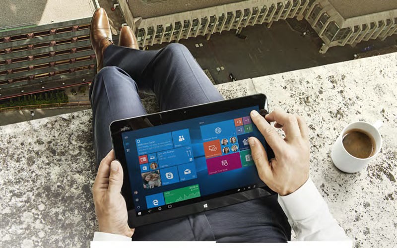 Man holding a Fujitsu tablet