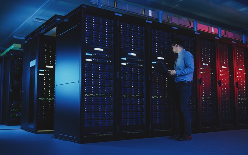 Run your apps wherever you need them and drive transformation with Google Cloud. Man working on server room