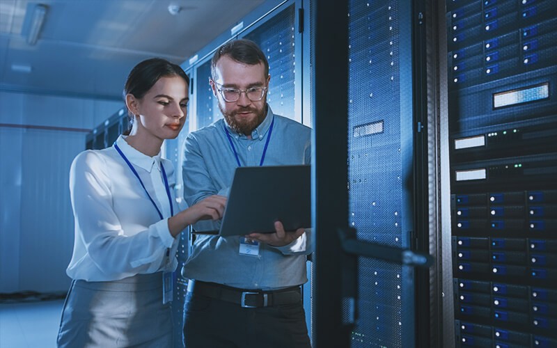 Make smarter business decisions and maximize insights from your data Professionals working on server room