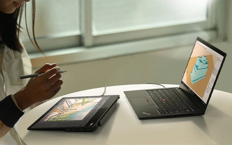 Preferred small business laptops woman working on a ThinkPad device