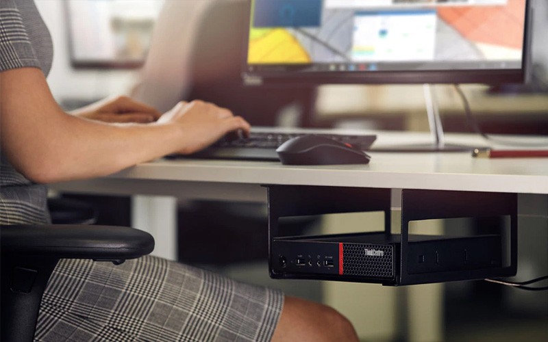 Tough, compact and powerful Woman using a ThinkCentre M Series SFF