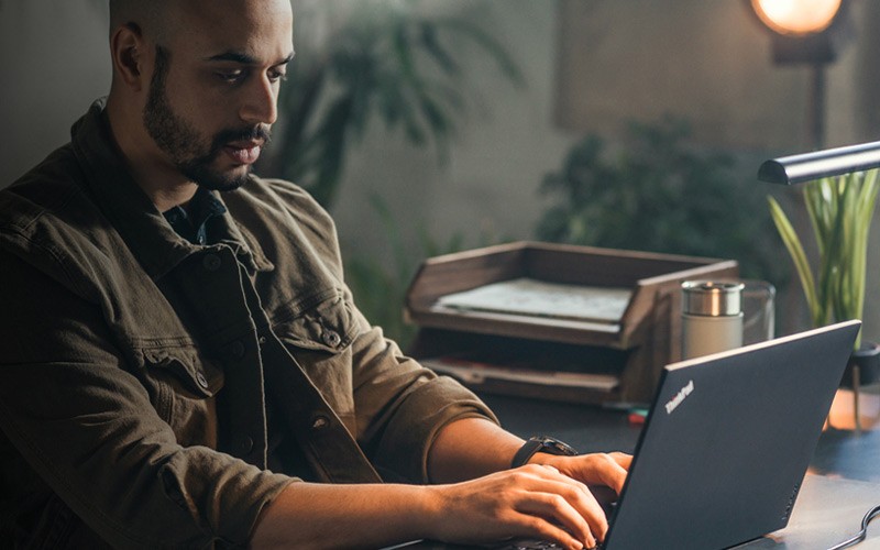 Technology solutions or SMBs from Lenovo Man using a ThinkCentre M Series SFF