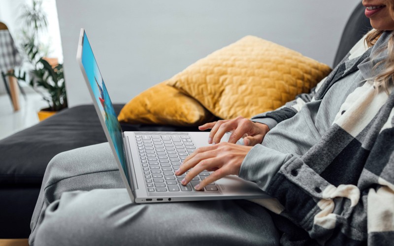 A roadmap to success Woman working at laptop on the sofa