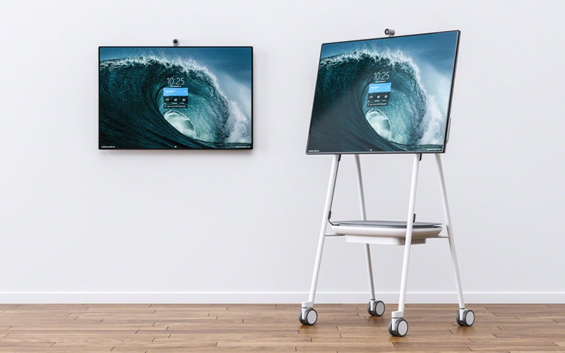 Surface Hub 2S interactive whiteboard brings teams together Woman using Surface Hub 2S for web meeting