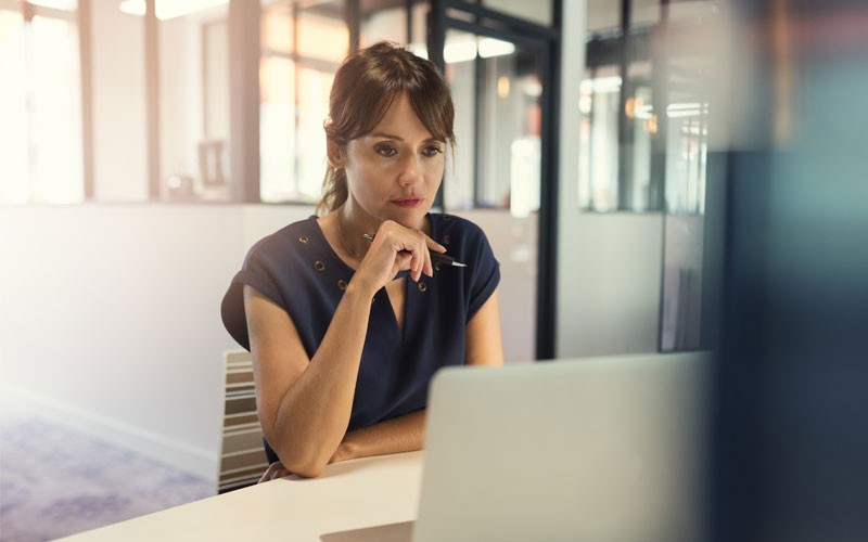 NetApp SnapLock Woman working on laptop