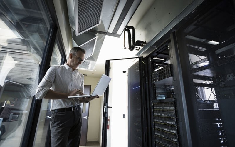 NetApp HCI future of data management Man working in data room