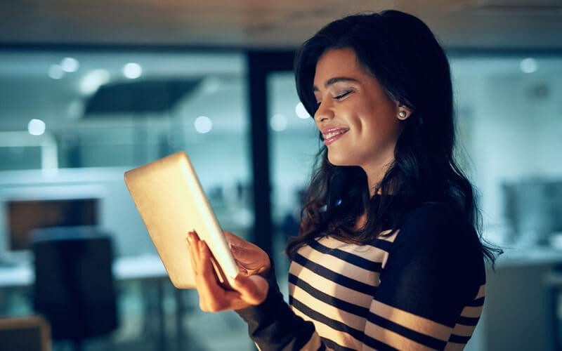 NetApp cloud data services Woman holding tablet device