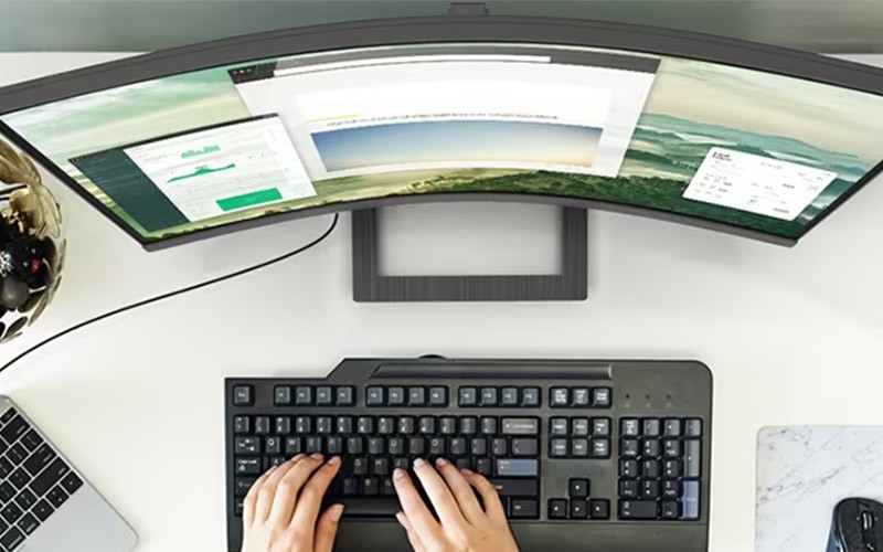 Woman using a curved monitor
