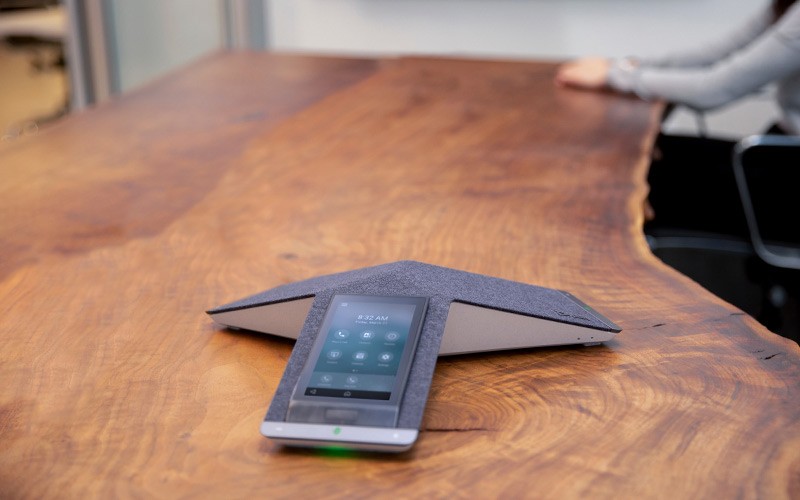 Poly conference phones deliver the clearest sound Group of people using Poly phone