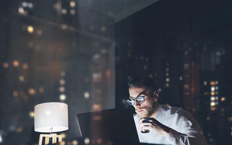 man working in a dark office