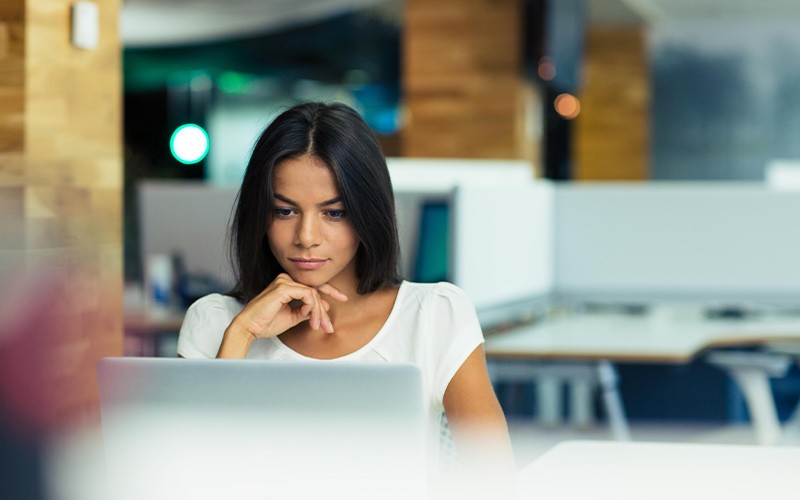 Intercept x is integrate into Sophos Central Woman working on a secure laptop