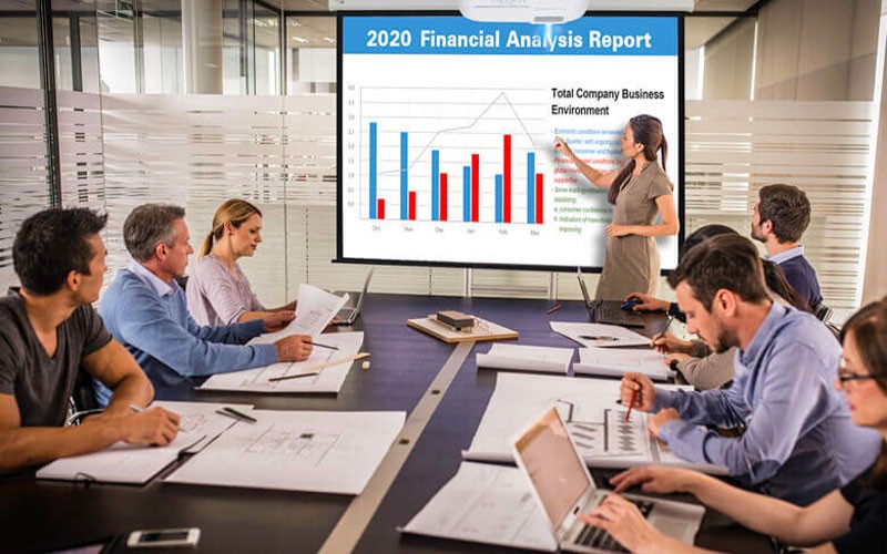 Woman presenting in front of colleagues 